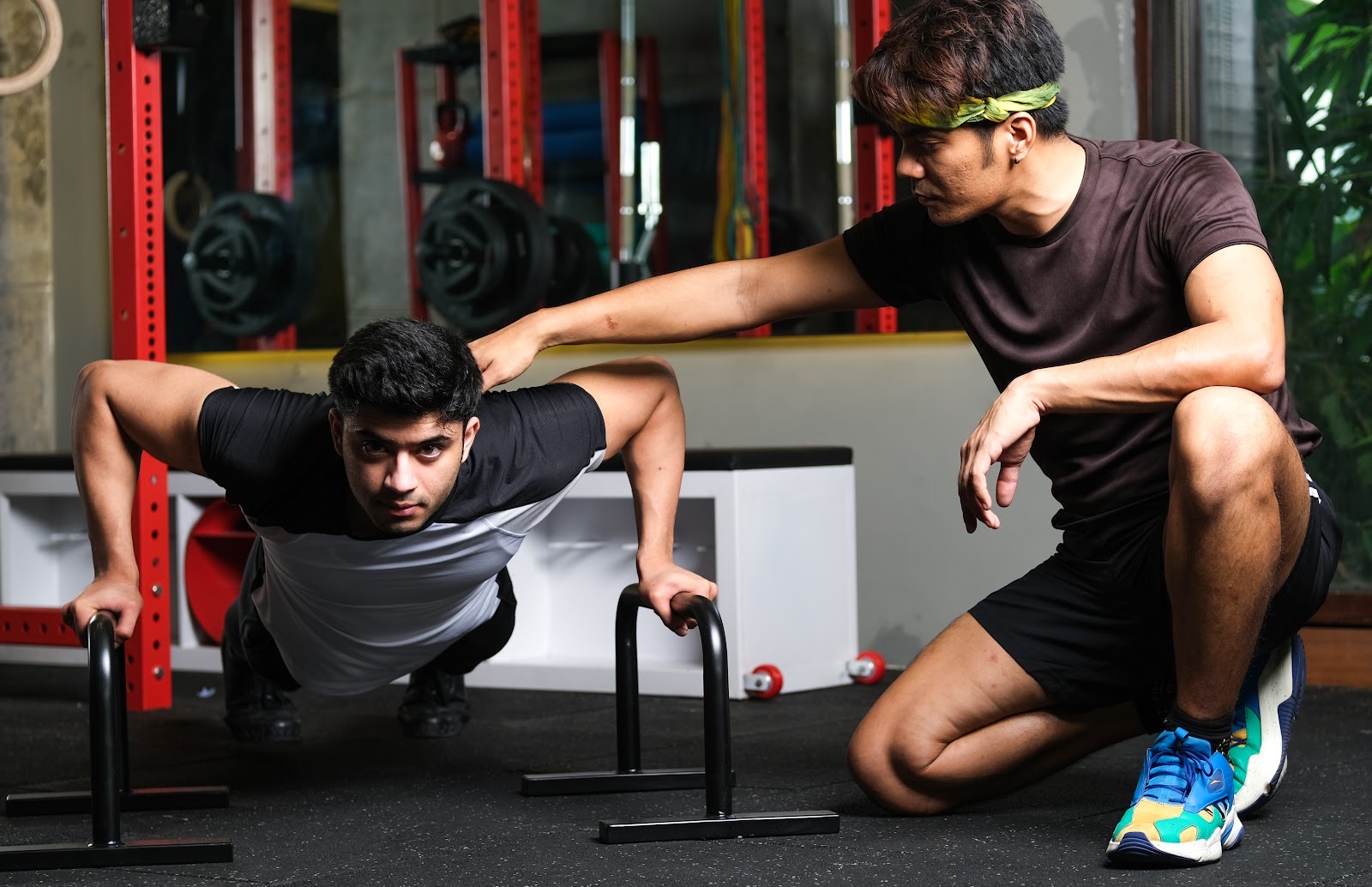 BoxFit coach guiding a client through a workout